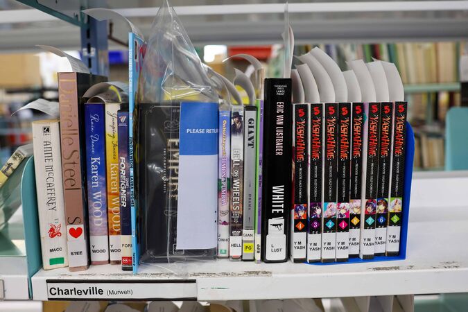 Books on a shelf labelled Charleville