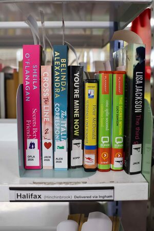 Library books on a shelf labelled Halifax