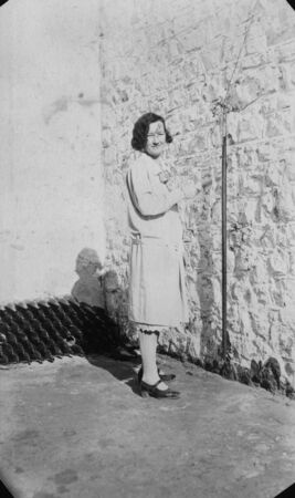 woman pulling cable to ring bell