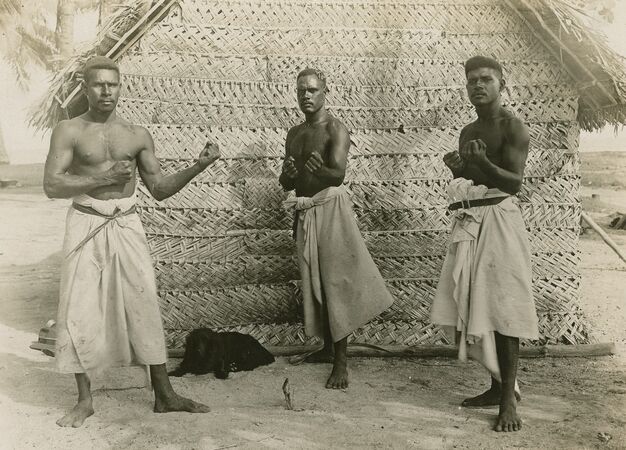 Pearl divers standing in boxing poses, 1920.
