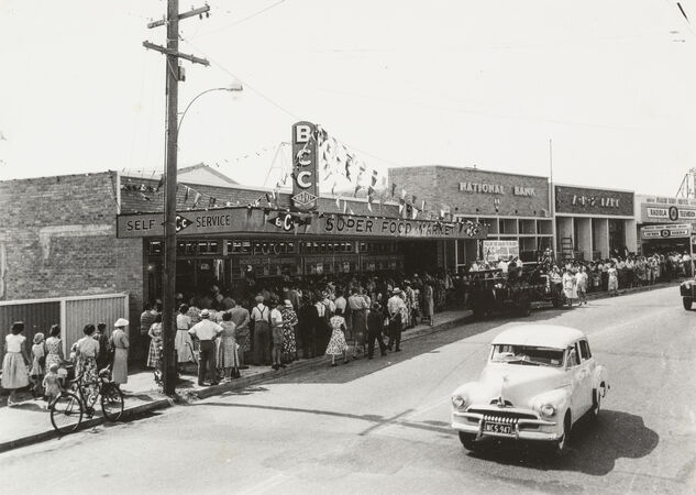 Shoppers waiting on the street to enter the Cash and Carry store Nundah, 1957