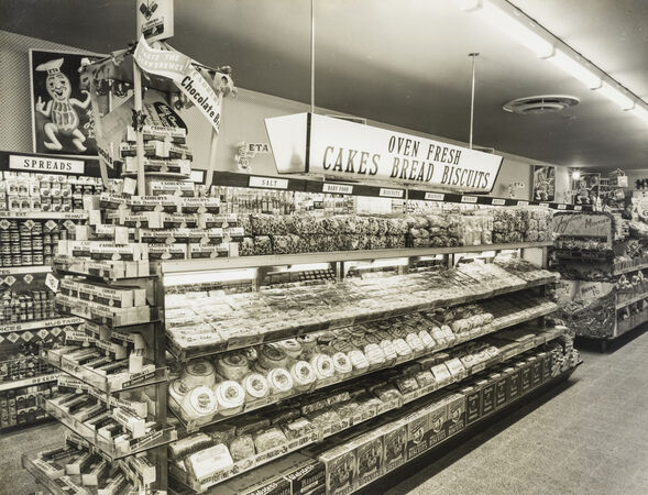 Cakes, breads and biscuits on shelves at the Cash and Carry store, Chermside, 1957