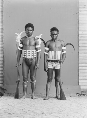 Untitled [two young men posing in a photographic studio], n.d.