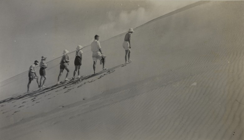 Holiday-makers walking up the Big Sandhills on Moreton Island in 1937.