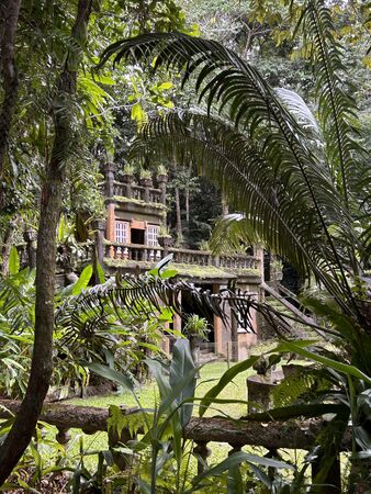 Peeking through the tropical garden, the Lower Refreshments Rooms, Paronella Park.