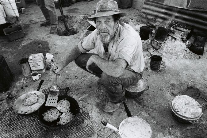 Man cooking at campsite