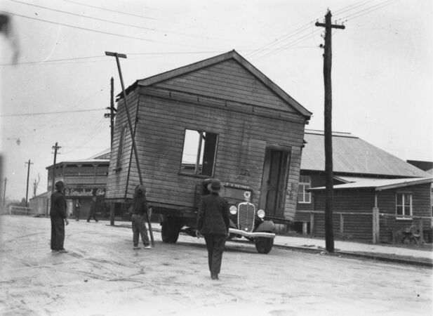 Old Tully Canegrowers office being removed by truck Brisbane John Oxley Library, State Library of Queensland, 1937. 