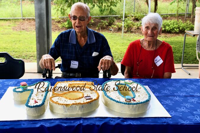 Former students at Ravenswood State School, Ron Eardman and Dot Weinheimer cut the 150th anniversary cake. 
