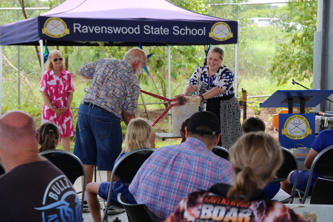 Former Principal Viv Bardon and Principal Katee Wakefield (2020-present) cutting open the school’s time capsule from 25 years ago.