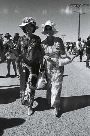 Two women dressed up for races 