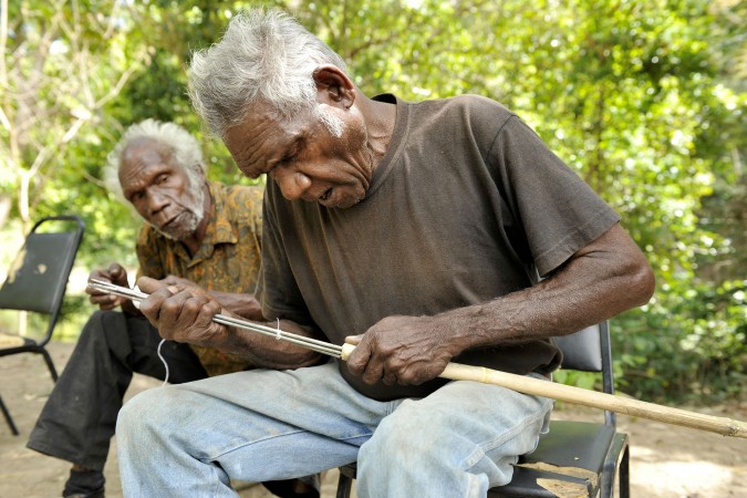 Jacky Ball watches Bobby Ball inserting prongs into a mullet spear