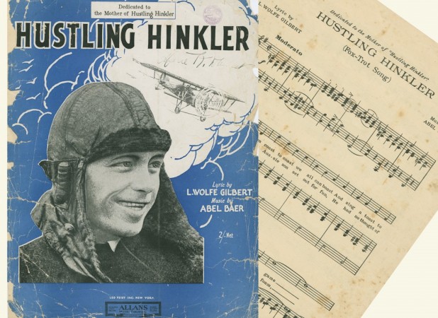 Music score cover featuring a man in an aviators hat with a bi-place sketched in the background in a cloud 