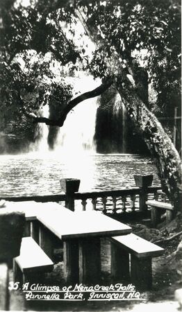 Tables near the swimming hole and Mena Creek Falls.