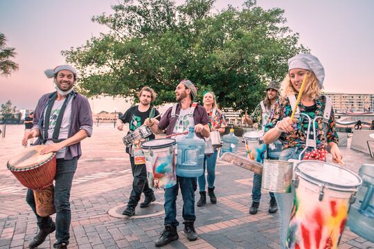 Roving percussion group with recycled instruments