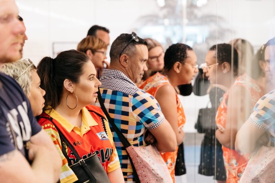 People looking at the Palm Island and Our People showcase in kuril dhagun. Photo by Joe Ruckli.