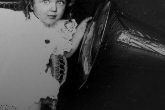 Child listening to a gramophone 1903-1913