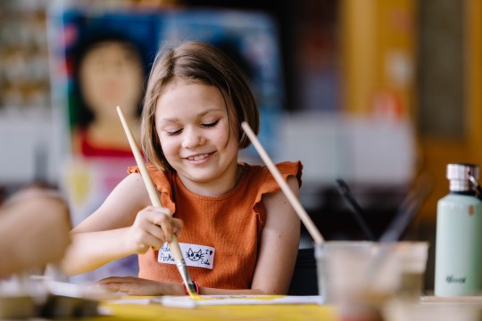 Child in art making activity