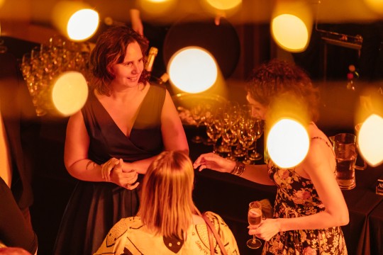 Tabitha Bird and Kali Napier at the 2021 Queensland Literary Awards It is night time with fairy lights and a bar in the background