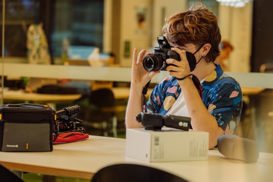 A photo of someone using a DSLR camera