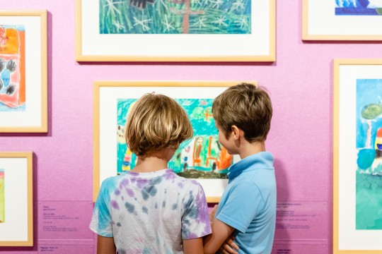 Children in an art exhibition.