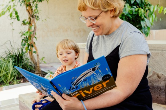 Family reading picture book, Joe Ruckli, 2023