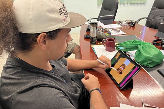 Workshop participant doing a digital drawing on a tablet