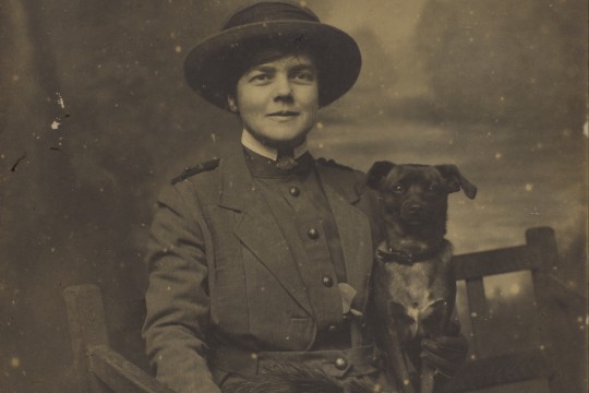 Studio portrait of Nurse Constance Keys with one of her pet dogs ca 1918 John Oxley Library State Library of Queensland Image 30674-0005-0051