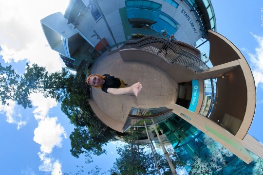 A photo taken with a 360 camera, the state library and the edge building are visiable on either side of the photo.