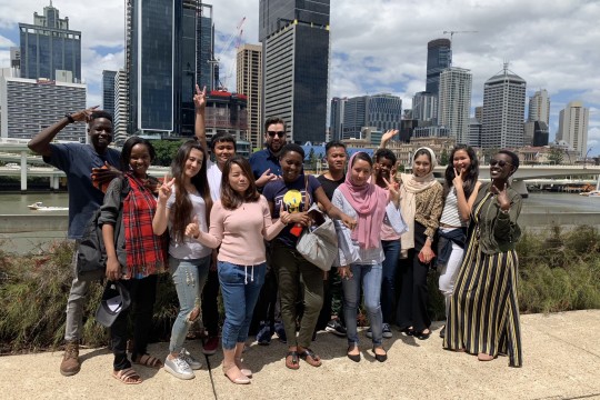 Group of Siganto Digital Learning Workshop graduates with Brisbane city in the background