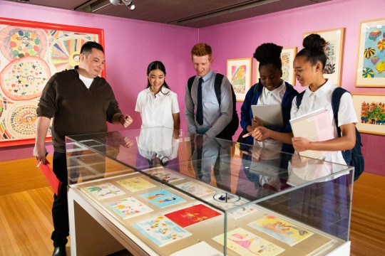 students engaging with exhibition at State Library