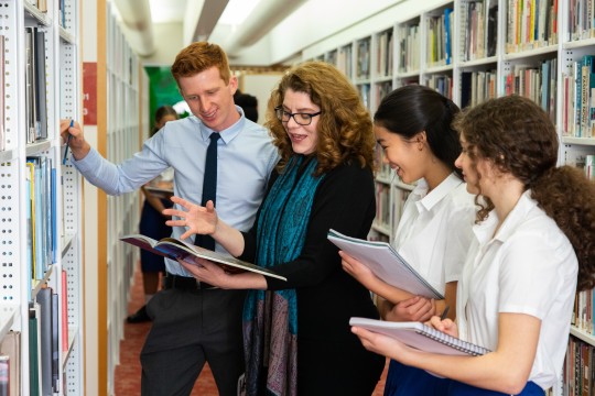 Teacher and students utilising State Library resources 