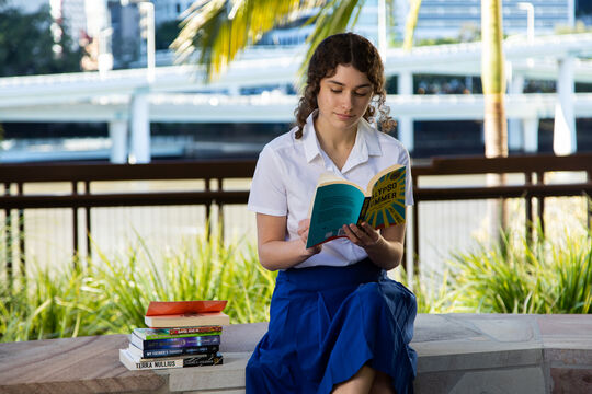 Student reading black&write! books