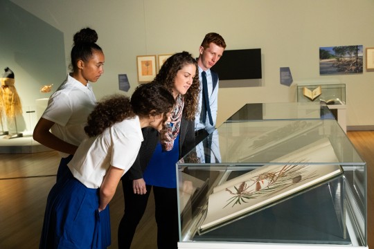 Teacher and students exploring an exhibition