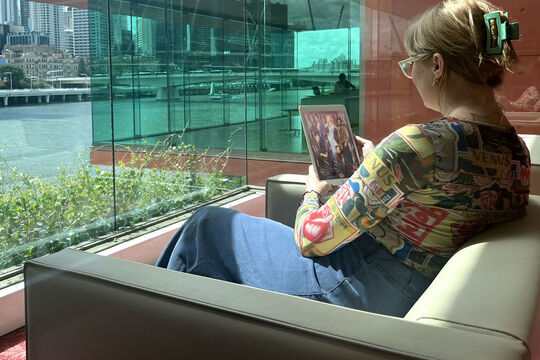 Woman reading tablet