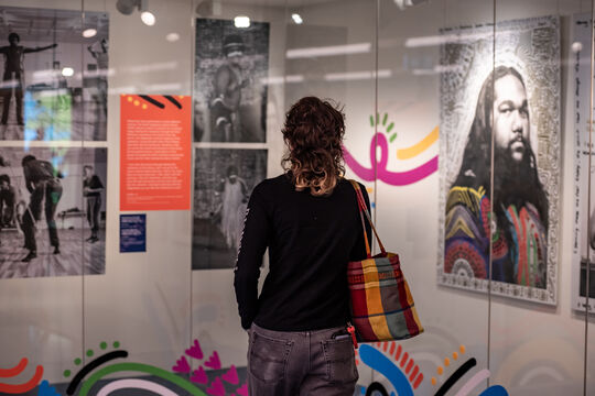 Visitor looking at Deaf in dance showcase in kuril dhagun