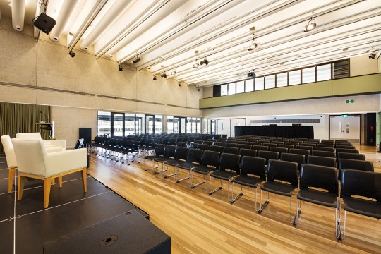 A large auditorium space at the Edge set with chairs