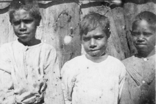Three Aboriginal children standing together 
