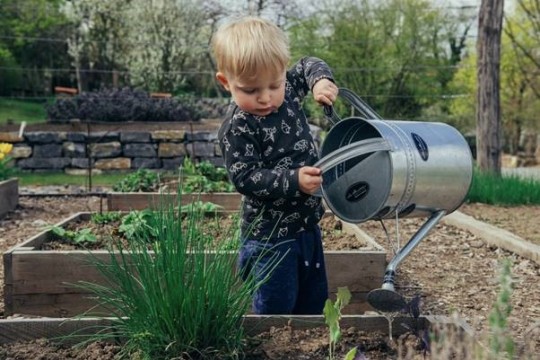 Child with watering can