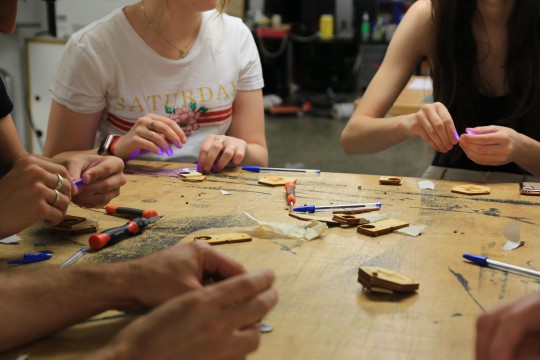 Inductees assembling the hand tools kit during the general induction