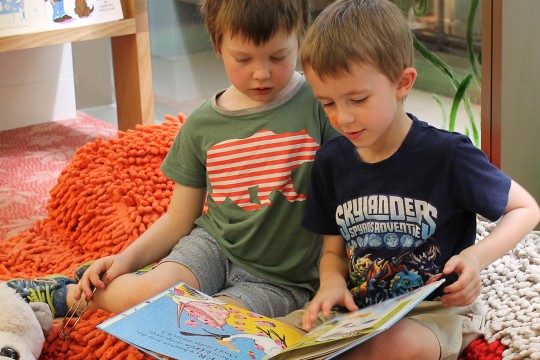 Two boys reading book State Library of Queensland
