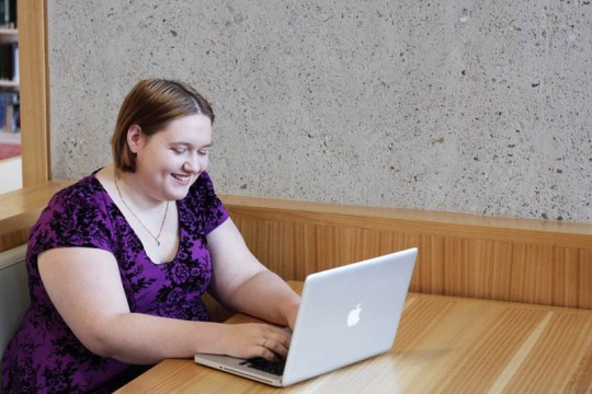 Woman using laptop at State Library Photo by Jeff Camden