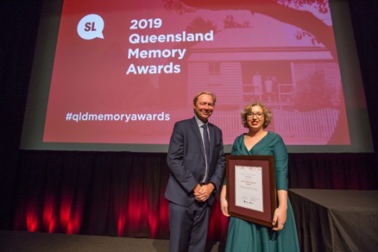 Kattie Pittock accepting the John Oxley Library Award on behalf of Paul Lyons 2019 Queensland Memory Awards