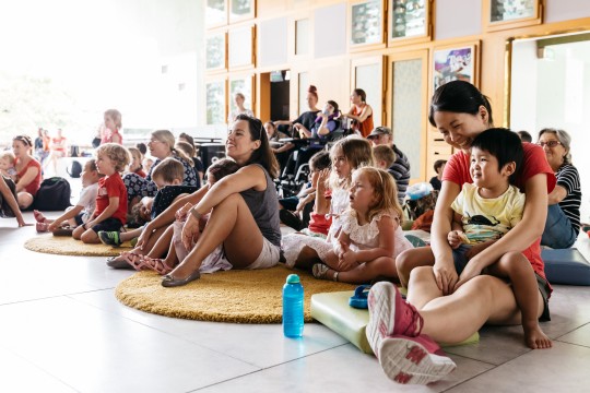 Parents and children as enjoying storytelling performance