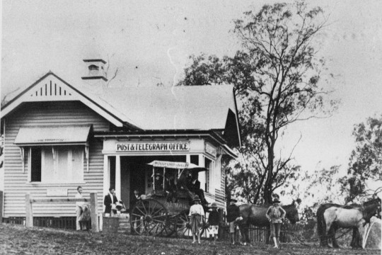 Postal workers loading the mail into horse drawn carriage at Woodford-Kilcoy Post and Telegraph Office ca 1913
