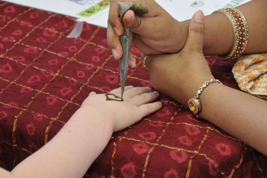 Mehndi decoration being drawn on a hand at the Queensland Multicultural Festival Brisbane 2009