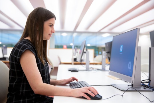 Woman using computer at the State Library of Queensland