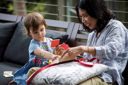 Woman and child with cards