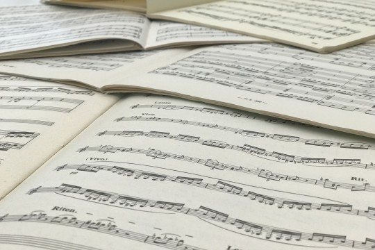 Music sheets open on a table