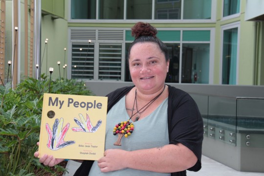 My People book held up by author Billie-Jean Taylor