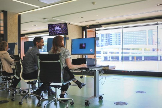 People using computers in the Digital Media lab